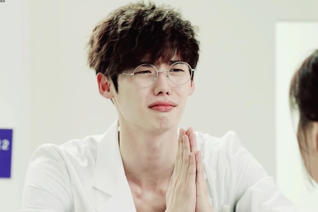 picture of Park Hoon with folded hands, trying to persuade someone