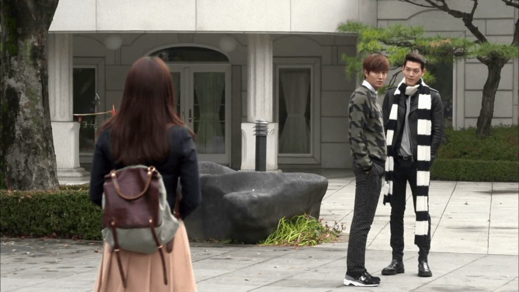 the heirs scene where Cha Eun-Sang looks at Kim Tan and Choi young-Do from afar. classic love triangle shot.