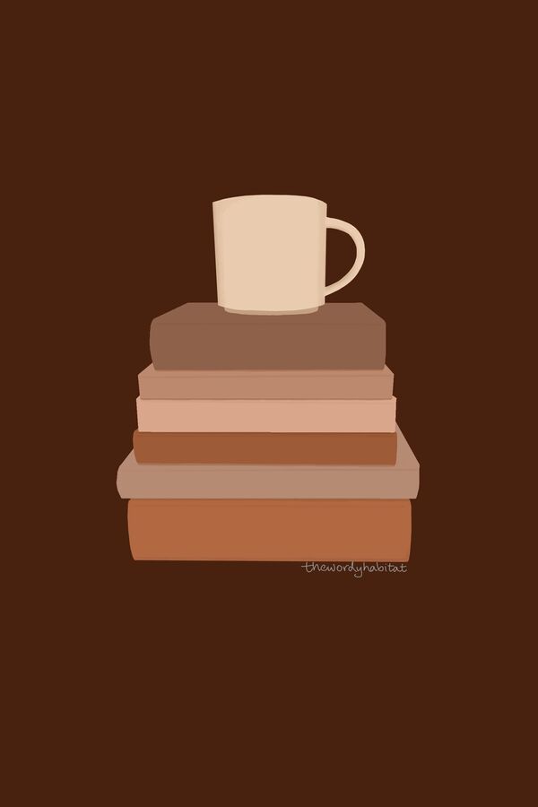 a stack of books with a mug on it