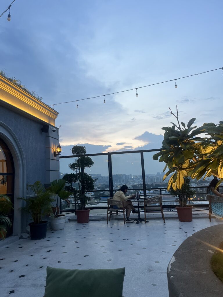 a shot from a rooftop cafe of the sky and beyond during sunset