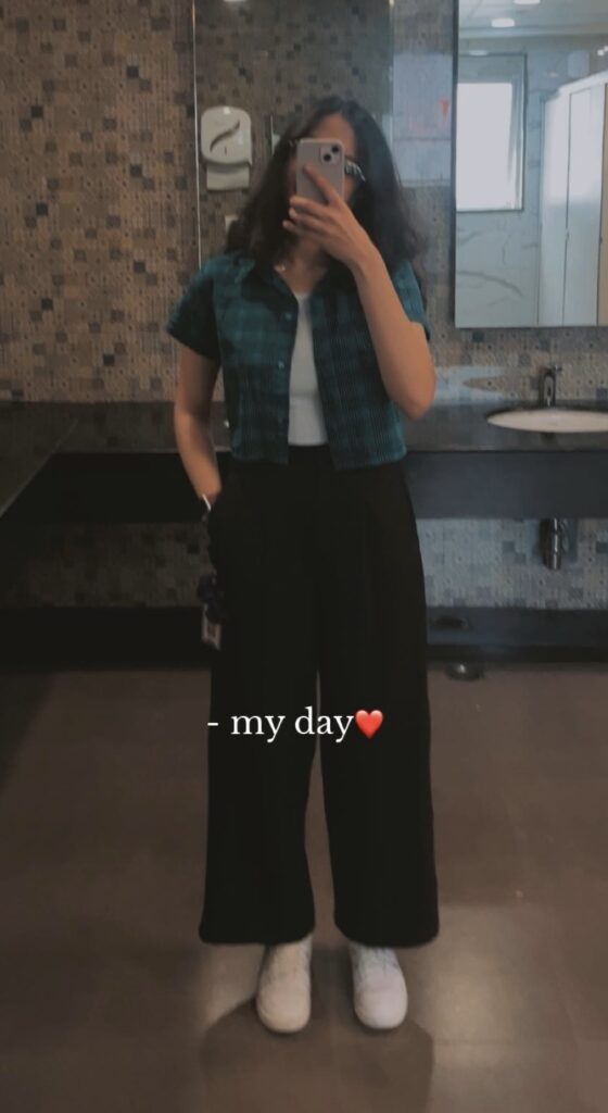 mirror selfie wearing black straight fit pants