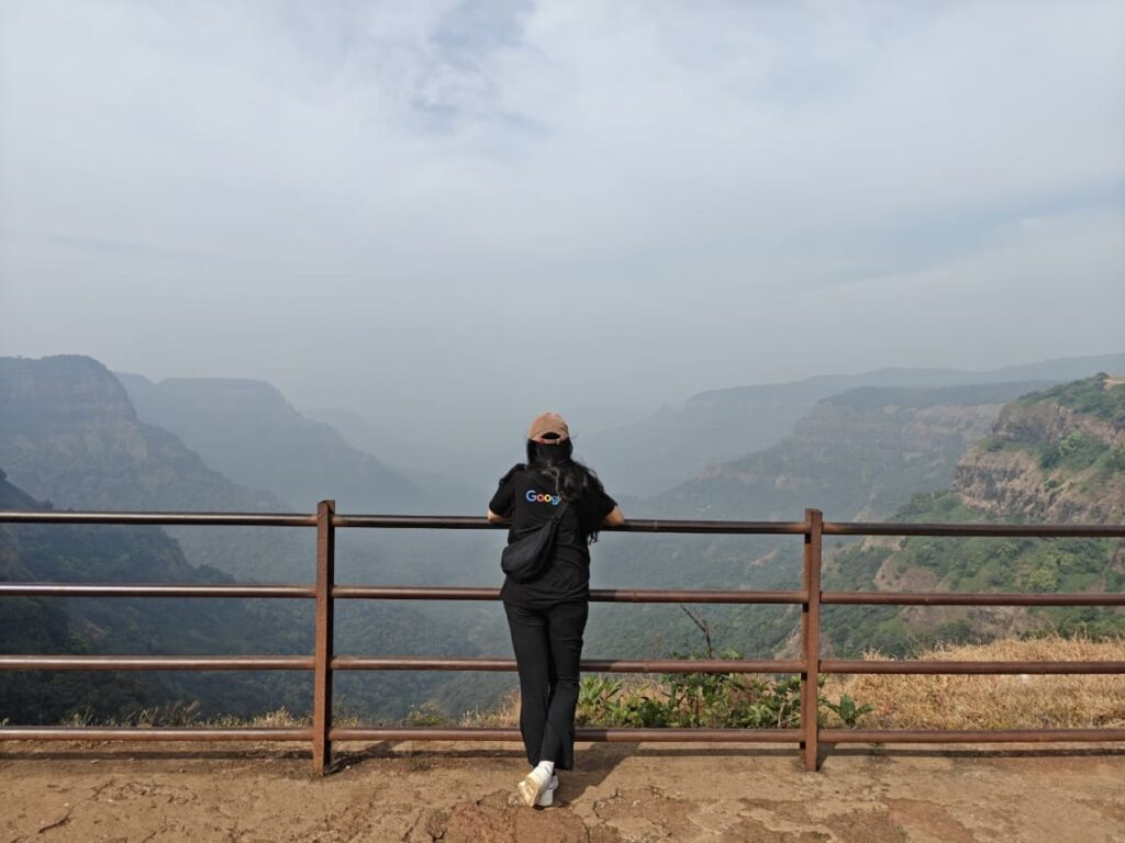 wearing black rare rabbit tshirt in a viewpoint in amboli, india
