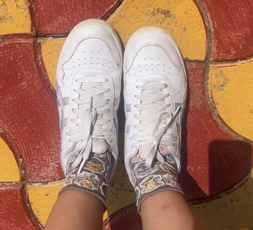 a photo of me wearing wall-of-paintings print socks