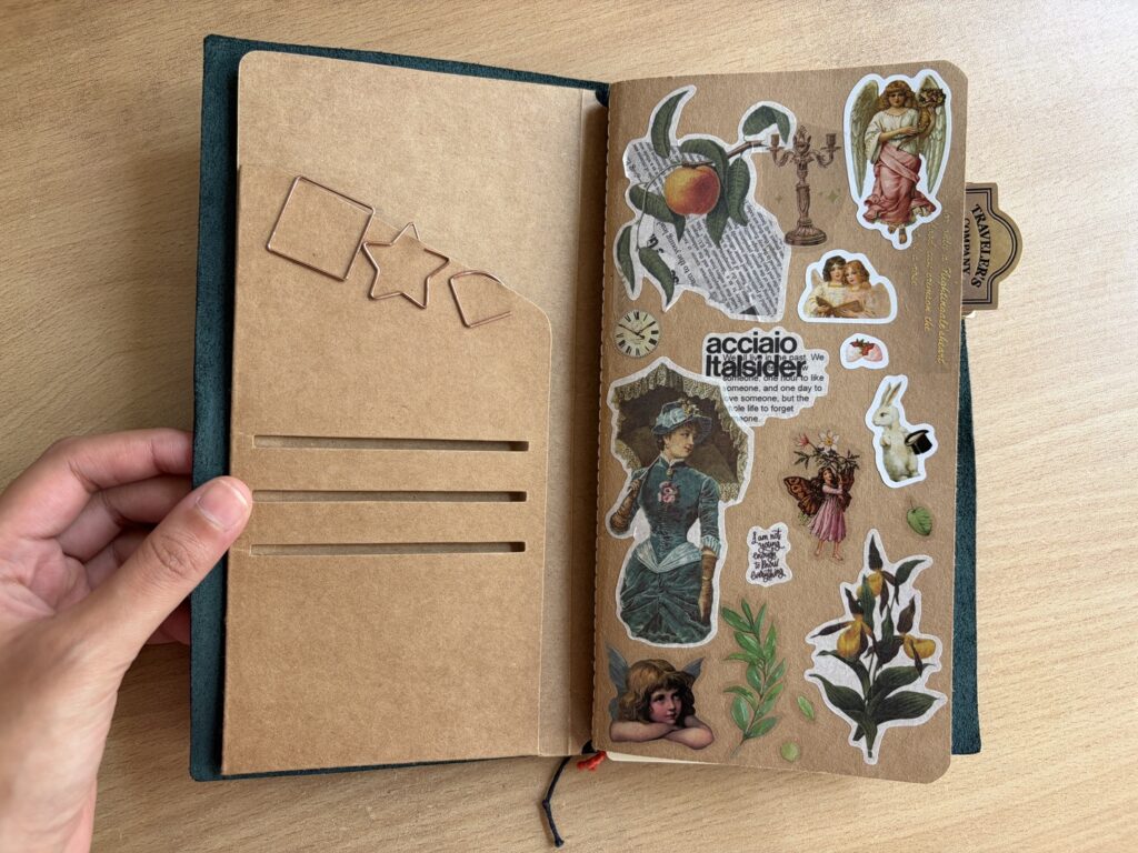 my traveler's notebook setup - kraft folder and a brown insert with lots of stickers on the cover